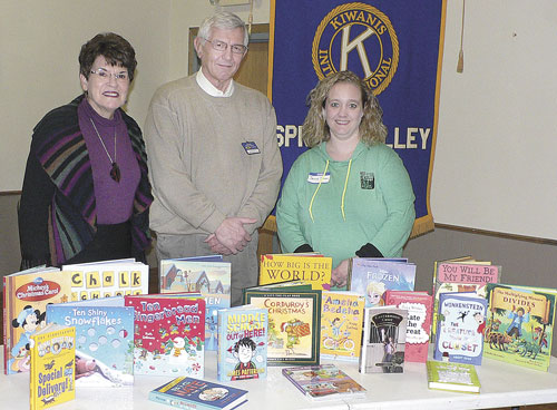 Kiwanis speakers help stock children’s section at public library